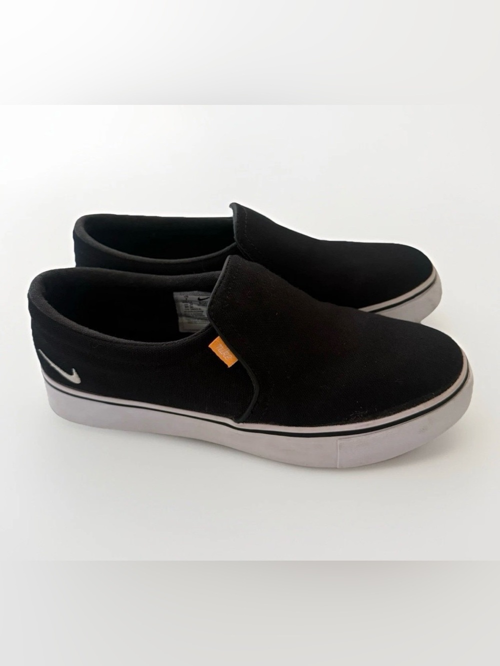 Nike Court Royale AC slip-on sneakers in a black and white Womens size 7